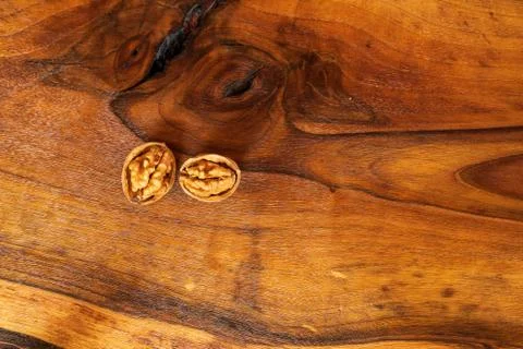 Walnuts on dark vintage table, Walnuts kernels in wooden bowl. Walnut healthy Stock Photos