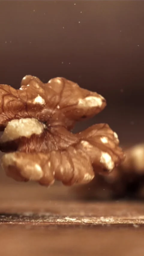 Walnuts fall on the table. Filmed on a high-speed camera at 1000 fps Stock Footage 335322014
