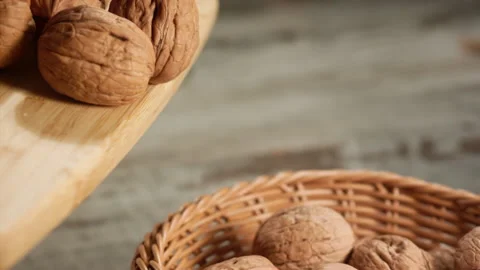 Walnuts falling close-up in a basket in slow motion Stock Footage 152176064