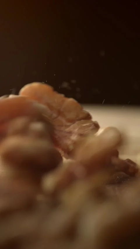 Walnuts falling in slow motion on a wooden surface Stock Footage 333398447