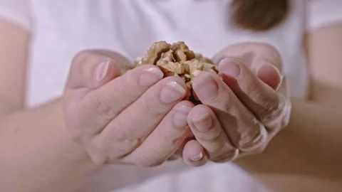 Walnuts in female hands. Stock-Footage 241351990