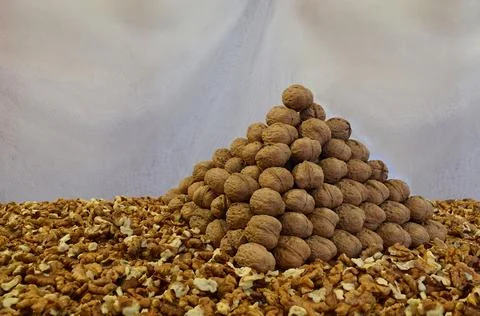 Walnuts folded in the shape of a triangular pyramid . 스톡 사진