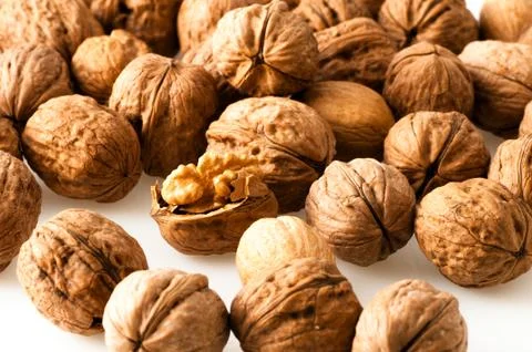 Walnuts in the foreground for diet Fotos de archivo