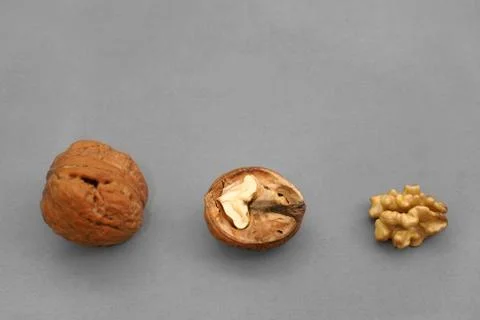 Walnuts on a gray background Stock Photos