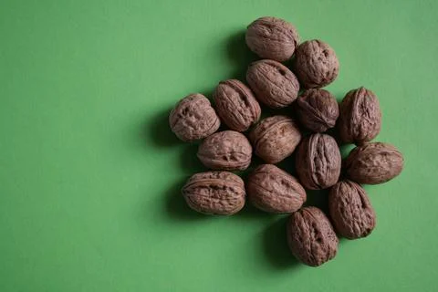 Walnuts on Green Background Stock Photos