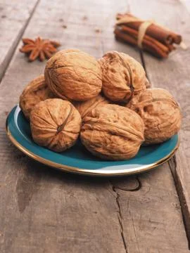 Walnuts on a green plate Stock Photos