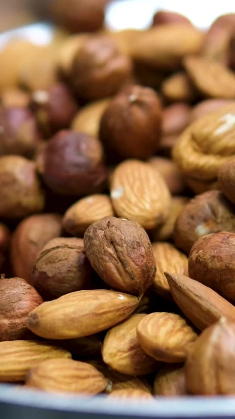 Walnuts with hazelnuts almonds cut and grind in a meat grinder chop the nuts Stock Footage 313392672