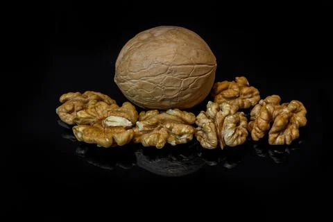 Walnuts isolated on black background with reflection Stock Photos