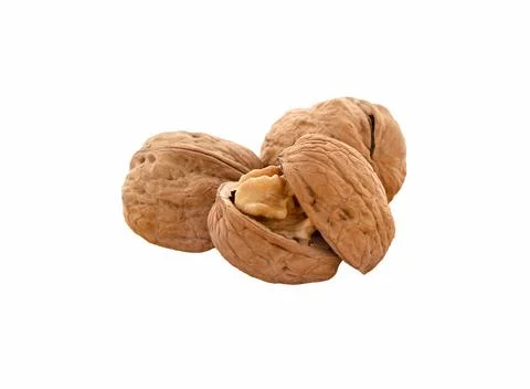Walnuts isolated. Unpeeled walnuts with shell, close-up. Stock Photos