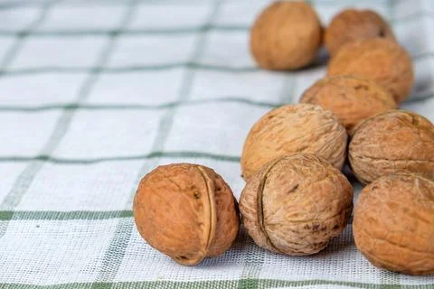 Walnuts isolated on a white towel.Space for text Stock Photos