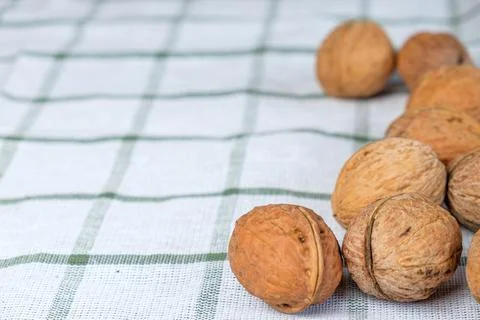 Walnuts isolated on a white towel.Space for text Stock Photos