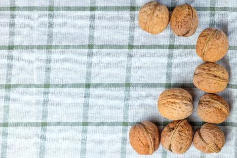 Walnuts isolated on a white towel.Space for text Stock Photos