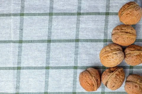 Walnuts isolated on a white towel.Space for text Stock Photos