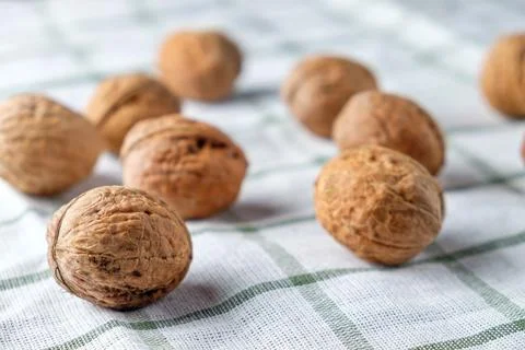 Walnuts isolated on a white towel.Space for text Stock Photos