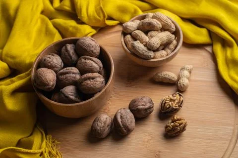 Walnuts kernels on dark desk with color background, Whole walnut in wood vint Stock Photos