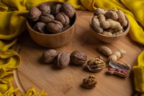 Walnuts kernels on dark desk with color background, Whole walnut in wood vint Stock Photos