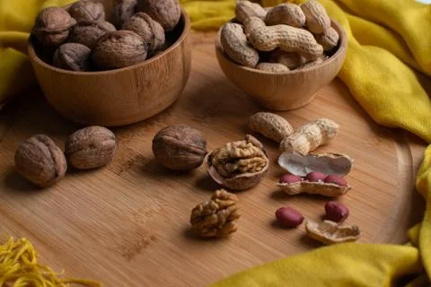 Walnuts kernels on dark desk with color background, Whole walnut in wood vint Stock Photos