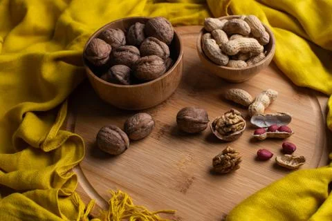 Walnuts kernels on dark desk with color background, Whole walnut in wood vint Stock Photos