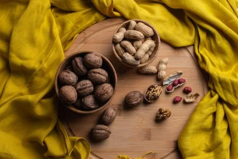 Walnuts kernels on dark desk with color background, Whole walnut in wood vint Stock Photos