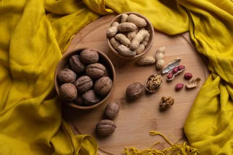 Walnuts kernels on dark desk with color background, Whole walnut in wood vint Stock Photos