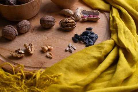 Walnuts kernels on dark desk with color background, Whole walnut in wood vint Stock Photos