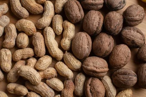 Walnuts kernels on dark desk with color background, Whole walnut in wood vint Stock Photos