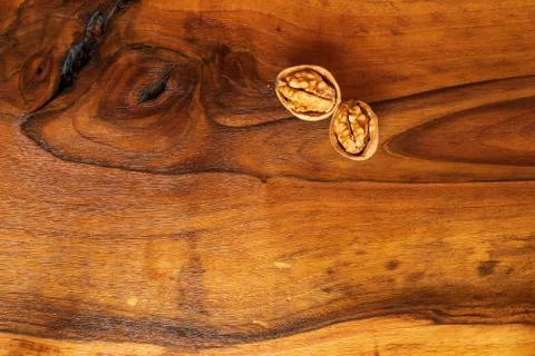 Walnuts kernels on dark desk with color background, Whole walnut in wood vint Stock Photos