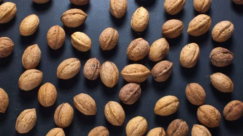 Walnuts moving on the table. Closed and peeling walnuts.  stop motion video Stock Footage 140122464