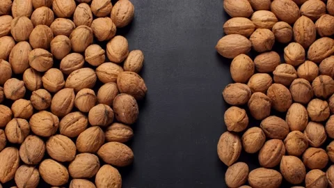 Walnuts moving on the table. Closed and peeling walnuts.  stop motion video Stock Footage 140260906