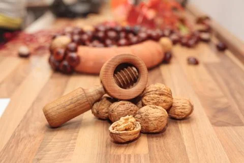 Walnuts with a nutcracker. Stock Photos