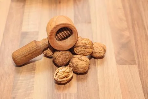 Walnuts with a nutcracker. Stock Photos