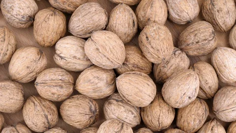 Walnuts onwood background loop rotating Stock Footage 85956246
