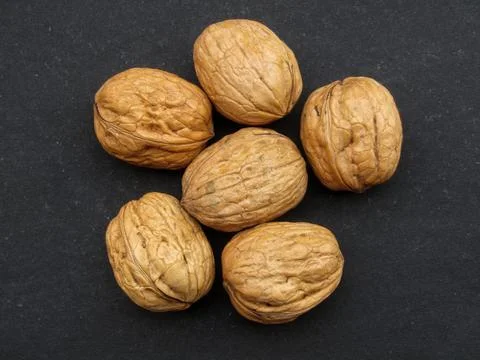 Walnuts or Akhroot on black background  Fotos Stock