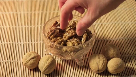 Walnuts, peeled walnuts are in a bowl in the kitchen Stock Footage 264096943