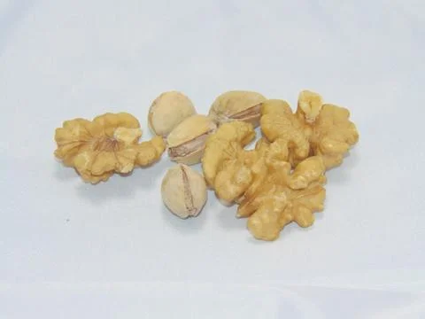 Walnuts with pistachios Stock Photos