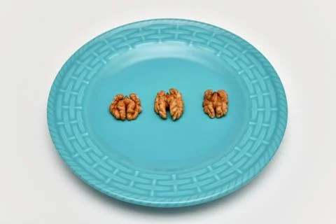 Walnuts on the plate Stock Photos