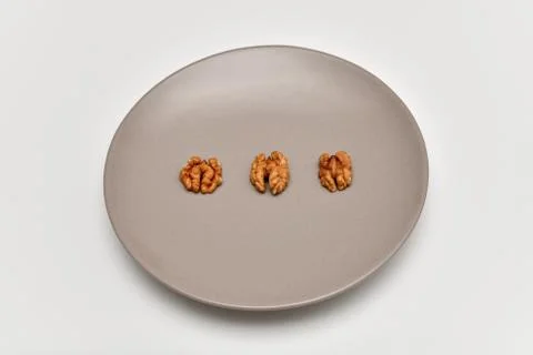 Walnuts on the plate Stock Photos