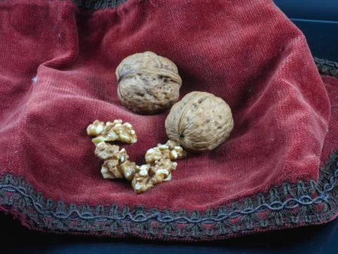 Walnuts in a red cloth Stock Photos