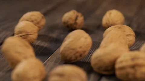 Walnuts roll from Right to Left Closeup Stock Footage 99165713