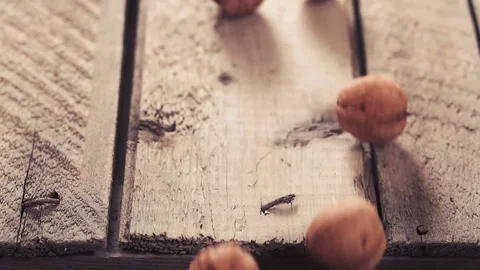 Walnuts rolling on the rustic table. Stock Footage 85063794