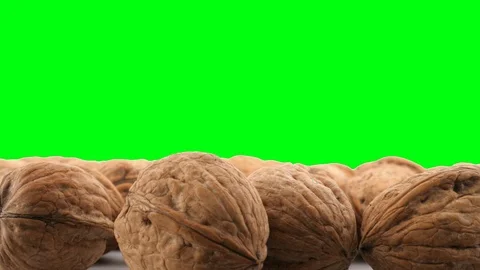 Walnuts rotating on green background Stock Footage 85961194