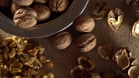 Walnuts in rotation on sackcloth background Stock Footage 71354005