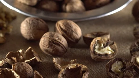 Walnuts in rotation on sackcloth background Stock-Footage 71354516
