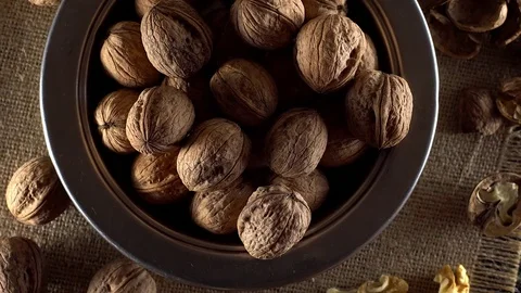 Walnuts in rotation on sackcloth background 库存影片 71355962