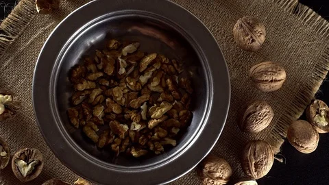 Walnuts in rotation on sackcloth background Video stock 71357065