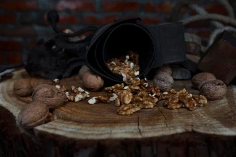 Walnuts on Rustic Old Table with Vintage Hand Grinder Stock Photos