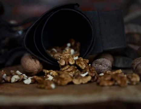 Walnuts on Rustic Old Table with Vintage Hand Grinder Stock Photos