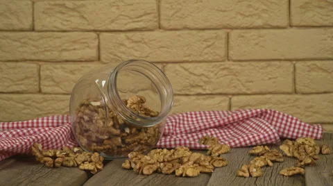 Walnuts on rustic old wooden table Stock Footage 63557295