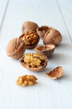 Walnuts on rustic old wooden table Stock Photos