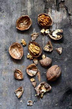 Walnuts on rustic old wooden table Stock Photos
